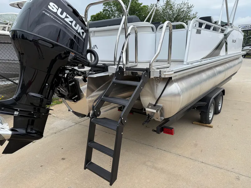 Slide: The Image of 2025 Avalon LSZ Versatile Rear Lounger pontoon boat with Suzuki outboard motor and trailer. - 7
