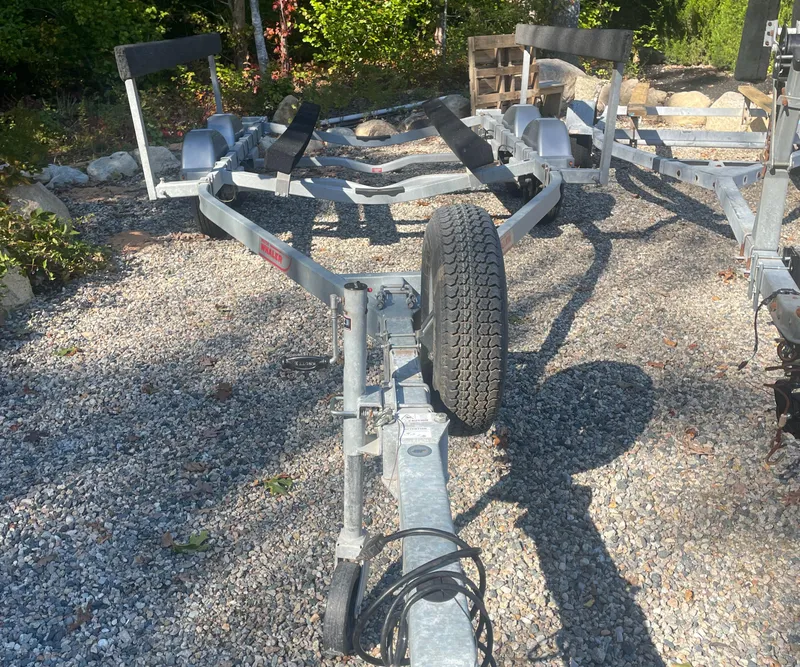 Slide: The Image of Boat trailer for 2021 Boston Whaler 210 Montauk on gravel surface. - 16