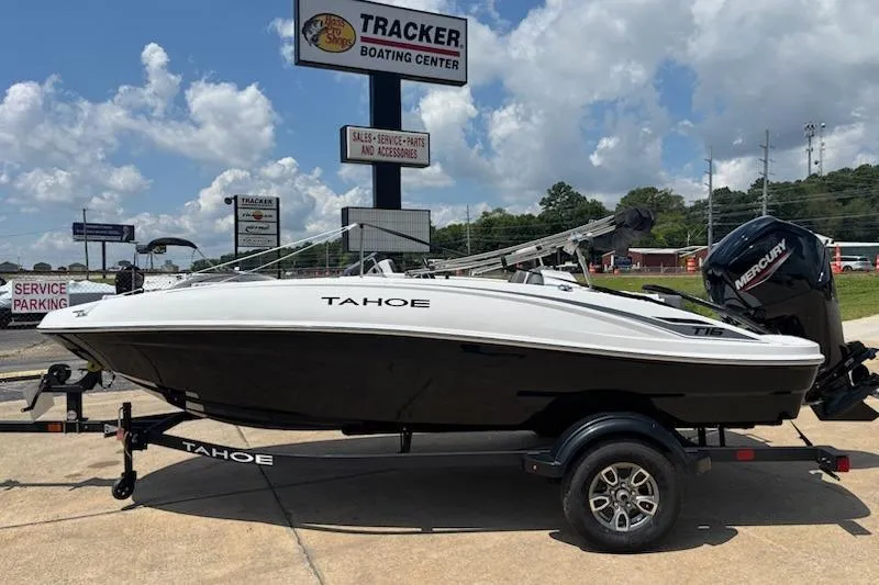 The Image of 2025 Tahoe T16 boat on trailer at Tracker Boating Center under clear skies. - 0