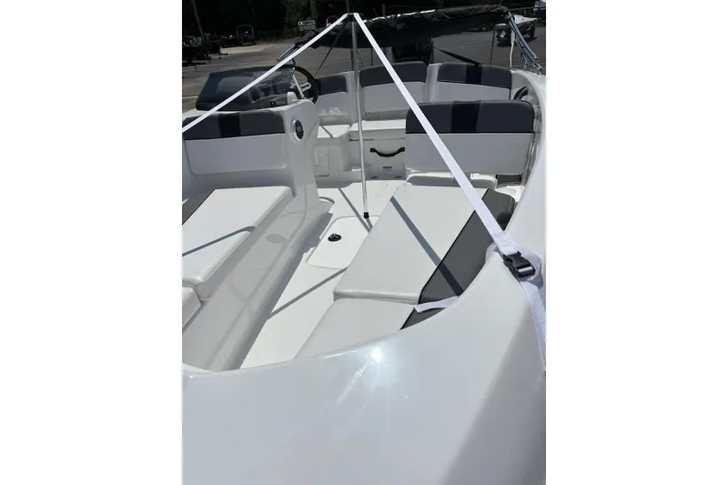 Slide: The Image of 2025 Tahoe T16 boat interior with white and black seating, showcasing modern design. - 2