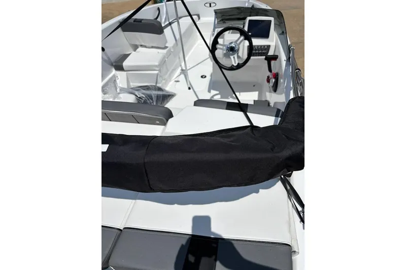 Slide: The Image of 2025 Tahoe T16 boat interior with steering wheel and seating, featuring modern design elements. - 3