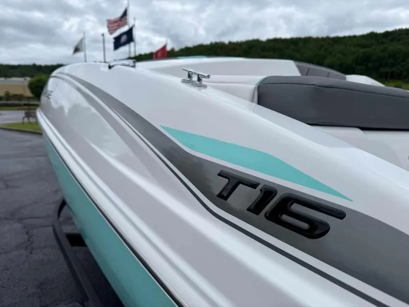 Slide: The Image of 2025 Tahoe T16 boat with sleek design and modern features, parked outdoors. - 3