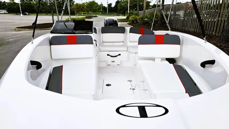 Slide: The Image of 2025 Tahoe T16 boat interior with white and gray seating, red accents, and spacious layout. - 8