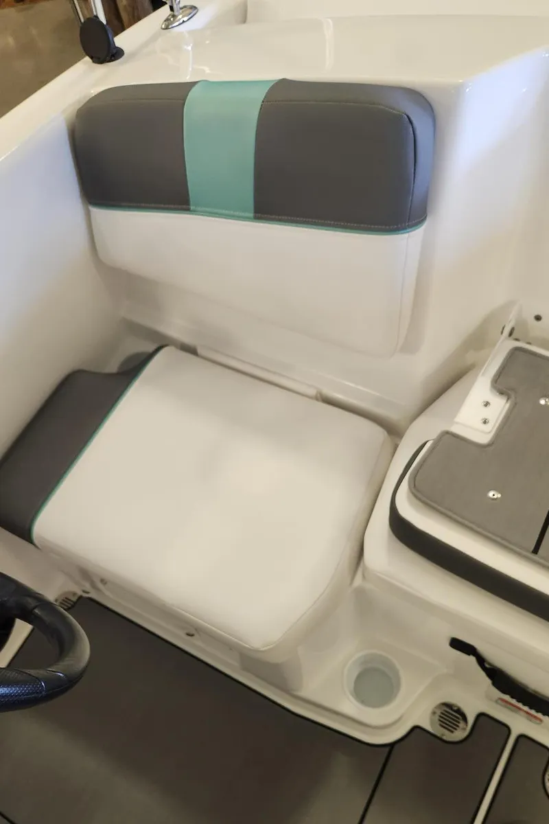 Slide: The Image of 2025 Tahoe T16 boat interior seating with gray and teal accents. - 4
