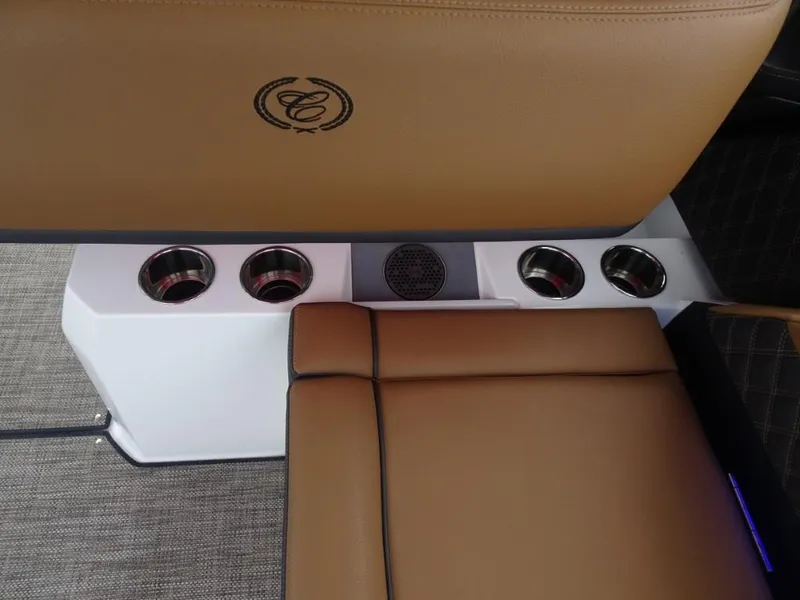 Slide: The Image of Luxurious seating with cup holders in 2025 Cobalt R31 boat interior. - 13