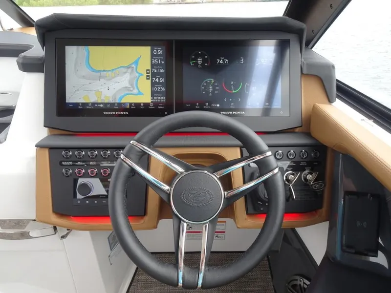 Slide: The Image of 2025 Cobalt R31 boat dashboard with dual screens and modern steering wheel. - 17