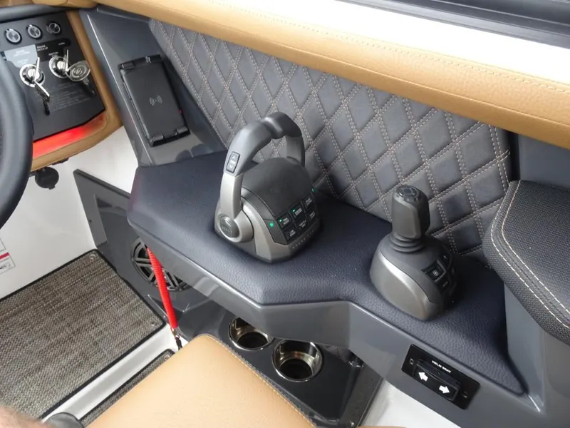 Slide: The Image of Interior of 2025 Cobalt R31 boat with modern controls and quilted paneling. - 18
