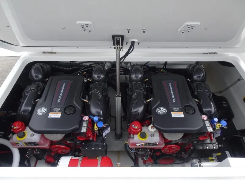 Slide: The Image of Twin engines in a 2025 Cobalt R31 boat engine compartment. - 26