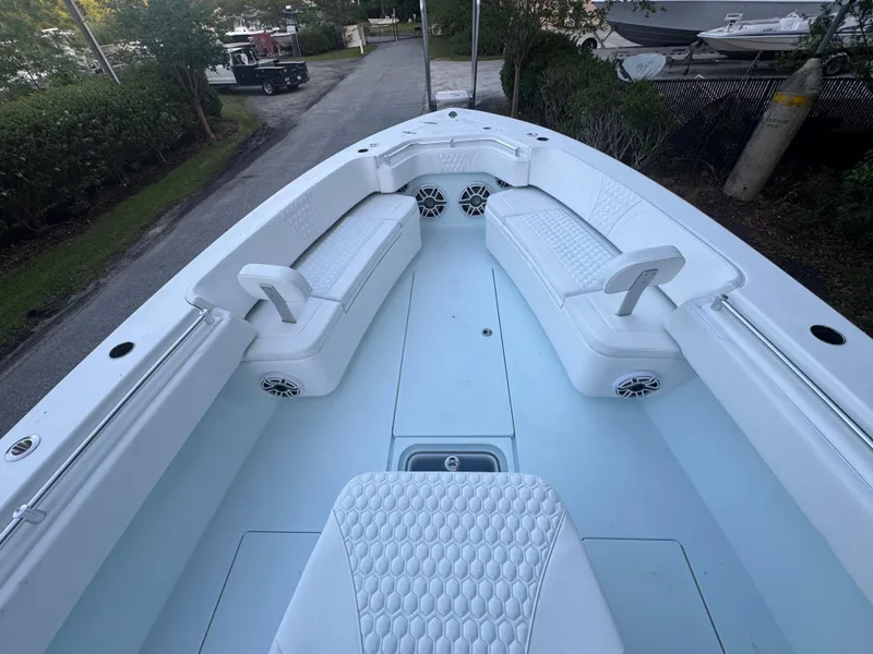 Slide: The Image of 2025 Contender 39ST boat interior with white seating and speakers. - 13