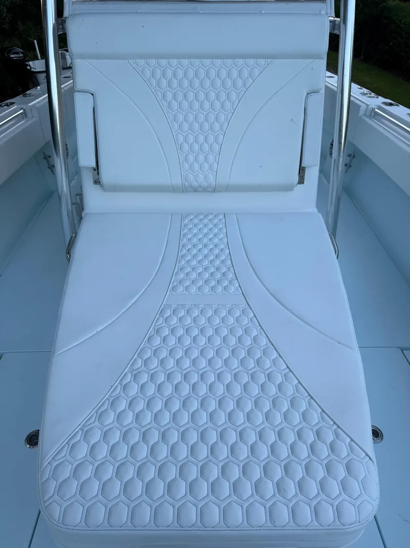 Slide: The Image of 2025 Contender 39ST boat seat with hexagonal pattern and sleek design. - 3