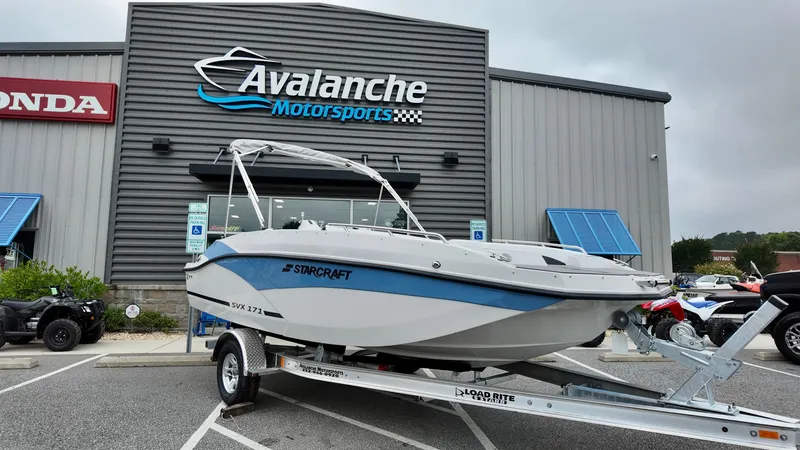 The Image of 2025 Starcraft SVX 171 OB boat on trailer at Avalanche Motorsports dealership. - 1