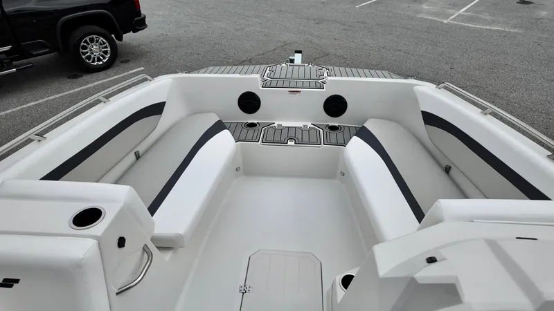Slide: The Image of 2025 Starcraft SVX 171 OB boat interior with white seating and black accents. - 11