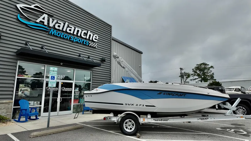 Slide: The Image of 2025 Starcraft SVX 171 OB boat on trailer outside Avalanche Motorsports. - 3