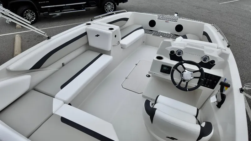 Slide: The Image of 2025 Starcraft SVX 171 OB boat interior with sleek seating and modern dashboard. - 4