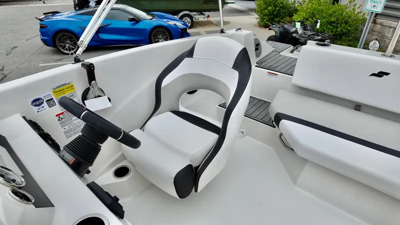 Slide: The Image of 2025 Starcraft SVX 171 OB boat interior with white and black seating. - 6