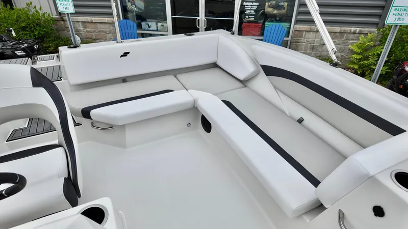 Slide: The Image of 2025 Starcraft SVX 171 OB boat interior with white and black seating. - 9