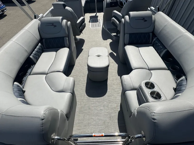 Slide: The Image of 2023 Bennington 24 LXFB pontoon boat with luxurious seating and modern design. - 11