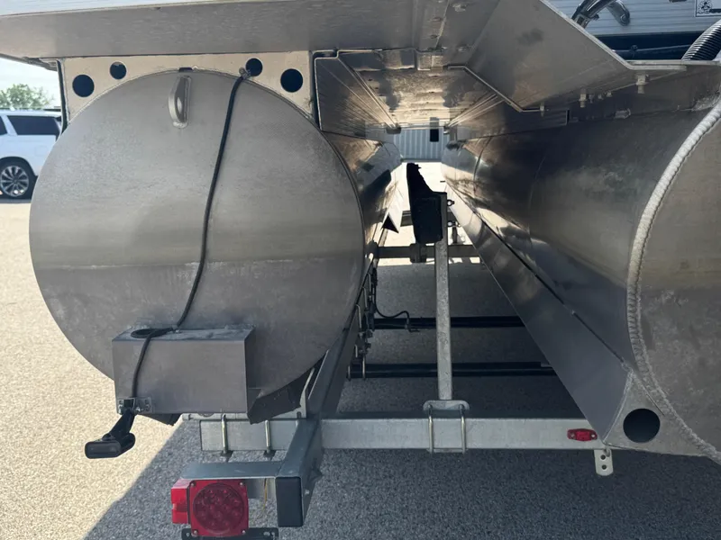 Slide: The Image of 2023 Bennington 24 LXFB boat interior with steering wheel and seating area. - 15