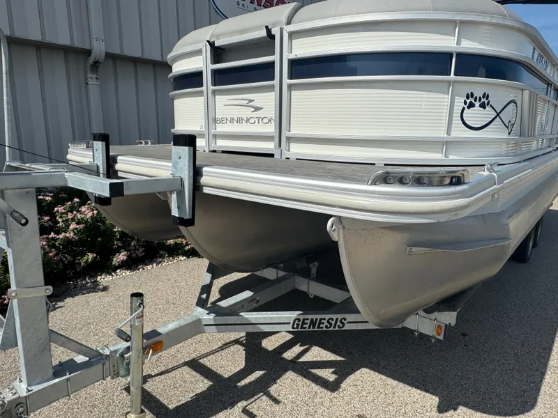 Slide: The Image of 2023 Bennington 24 LXFB pontoon boat interior with luxurious seating and cup holders. - 17