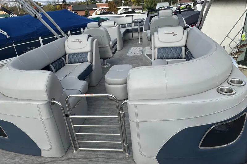Slide: The Image of 2023 Bennington 24 LXFB pontoon boat interior with luxurious seating and modern design. - 22