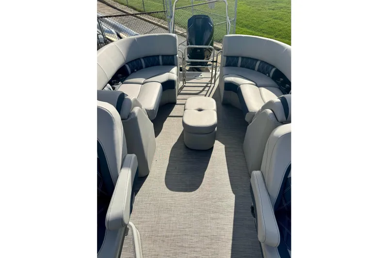 Slide: The Image of 2023 Bennington 24 LXFB pontoon boat interior with spacious seating and modern design. - 24