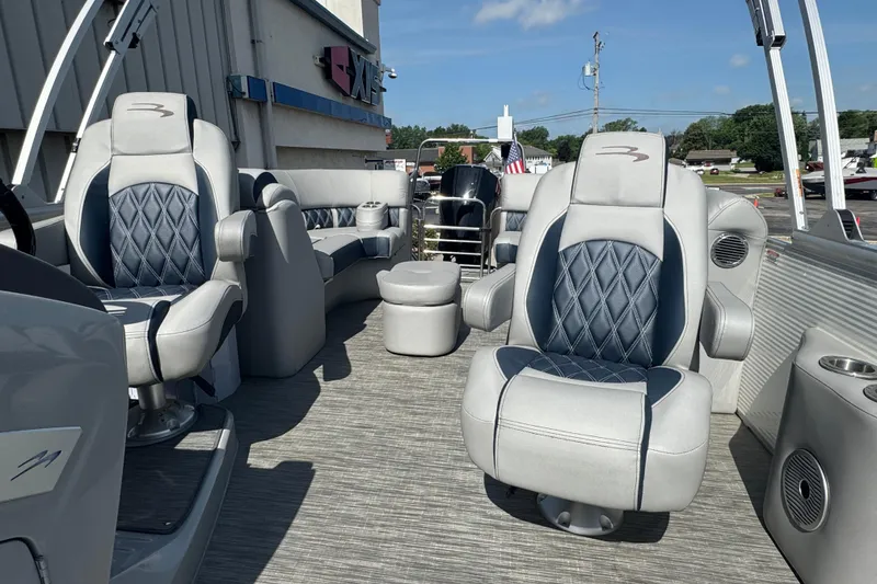 Slide: The Image of 2023 Bennington 24 LXFB pontoon boat interior with luxurious seating and modern design. - 26