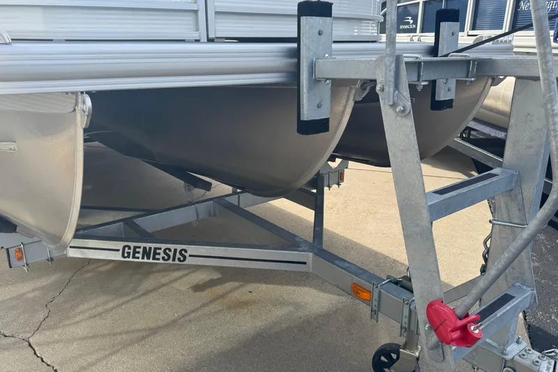 Slide: The Image of 2023 Bennington 24 LXFB pontoon boat on Genesis trailer, close-up view. - 30