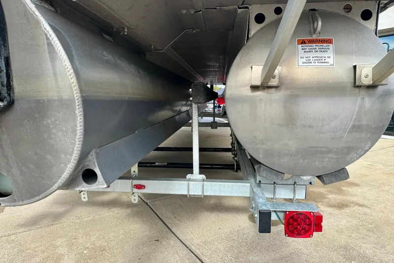 Slide: The Image of Underneath view of a 2023 Bennington 24 LXFB pontoon boat on a trailer. - 32