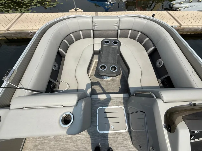 Slide: The Image of 2021 Bennington 23 LTFB pontoon boat interior with plush seating and cup holders. - 3