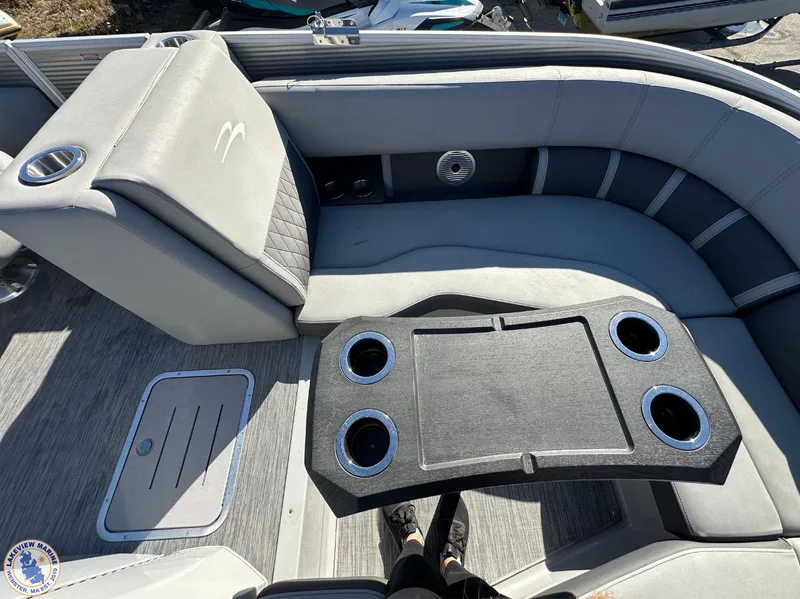 Slide: The Image of 2021 Bennington 23 LTFB boat interior with gray seating and cup holders. - 4