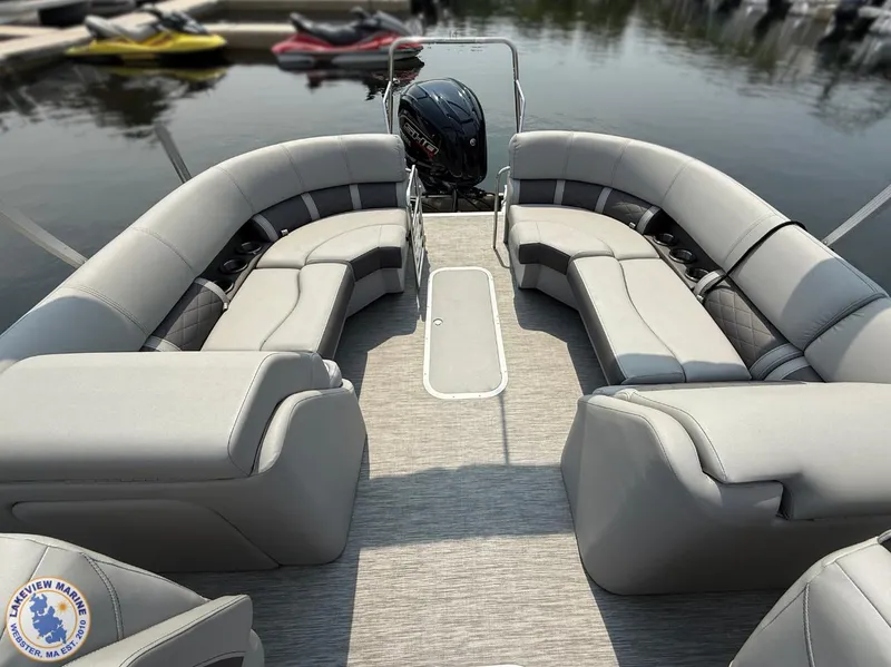 Slide: The Image of 2021 Bennington 23 LTFB pontoon boat with spacious seating and sleek design on calm water. - 7