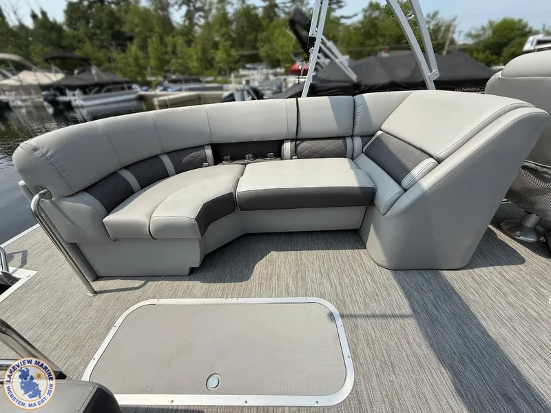 Slide: The Image of 2021 Bennington 23 LTFB pontoon boat with spacious gray seating area. - 8