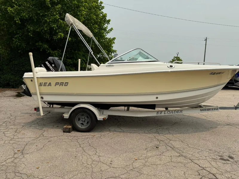 The Image of 2007 Sea Pro 186 Dual Console boat on trailer, parked outdoors. - 0