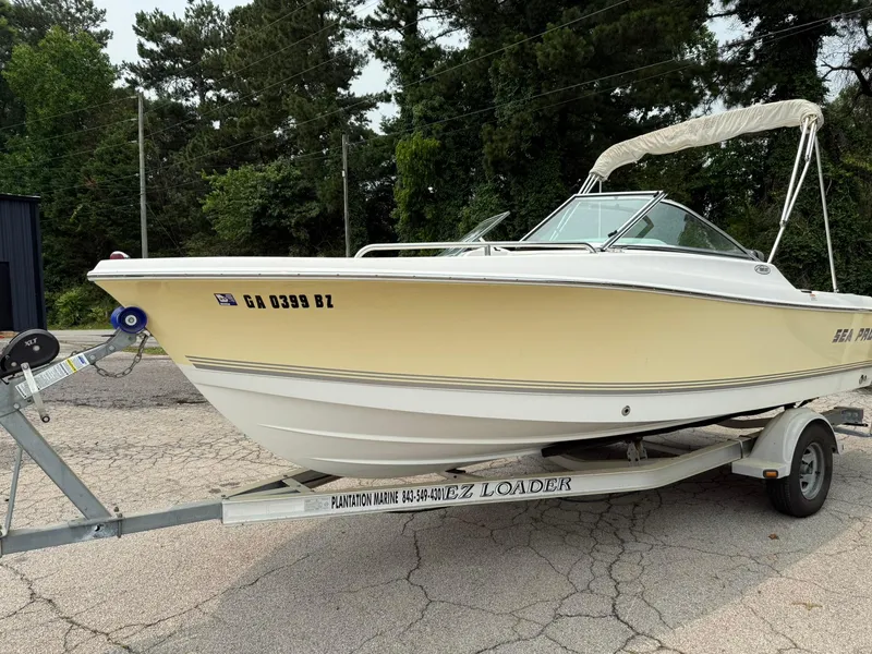 Slide: The Image of 2007 Sea Pro 186 Dual Console boat on trailer, parked outdoors. - 2
