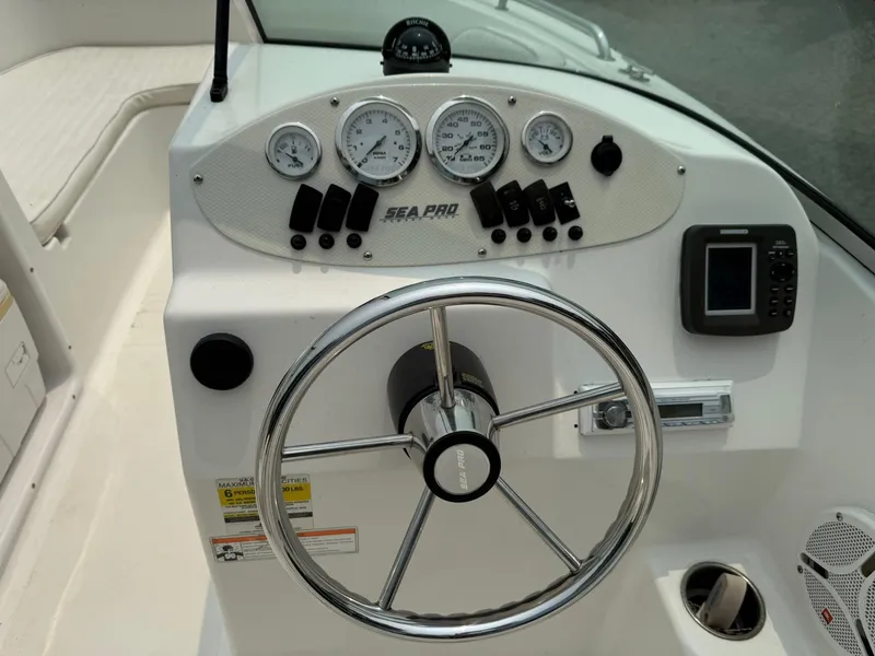 Slide: The Image of 2007 Sea Pro 186 Dual Console dashboard with steering wheel and gauges. - 8