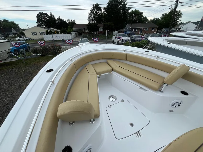Slide: The Image of 2025 Sportsman Open 232 Center Console boat with tan seating and spacious deck. - 15