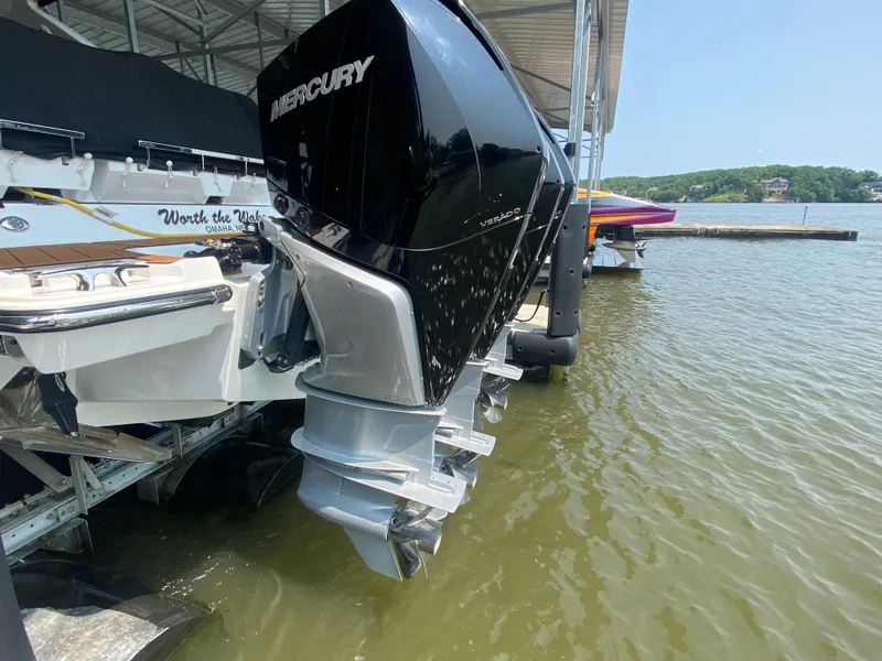 Slide: The Image of 2022 Monterey 385 Super Sport with Mercury outboard engine docked on a sunny day. - 10