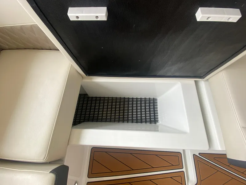 Slide: The Image of 2022 Monterey 385 Super Sport interior with seating and storage compartment. - 26