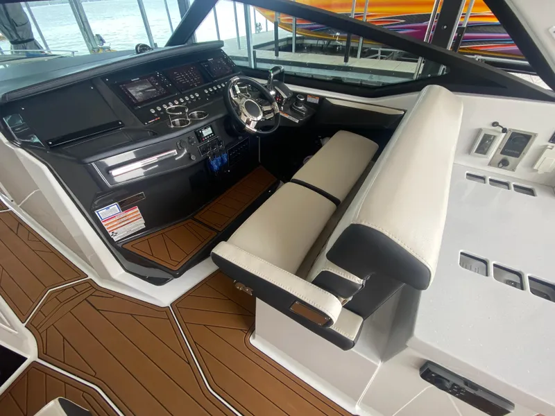 Slide: The Image of 2022 Monterey 385 Super Sport cockpit with modern controls and sleek seating. - 29