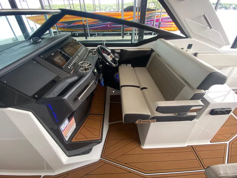Slide: The Image of 2022 Monterey 385 Super Sport boat interior with modern helm and seating. - 34