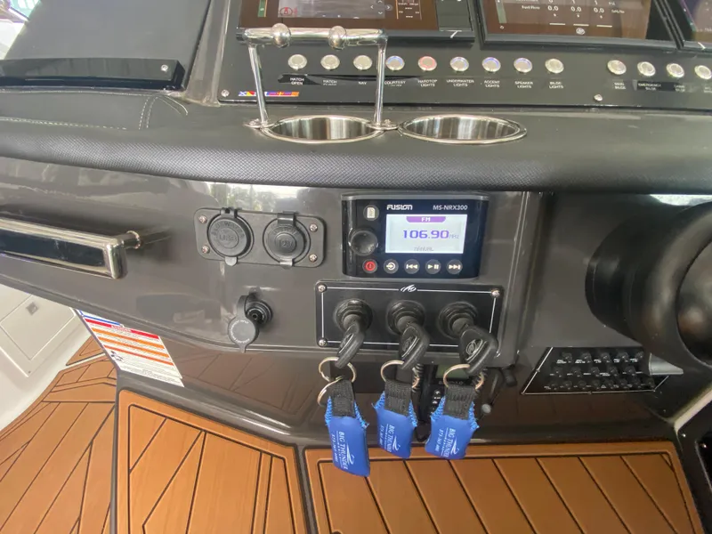 Slide: The Image of Control panel of 2022 Monterey 385 Super Sport boat with modern navigation equipment. - 37