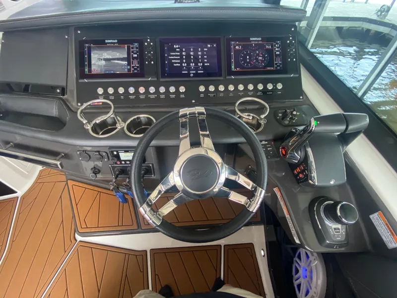 Slide: The Image of Cockpit of 2022 Monterey 385 Super Sport with advanced navigation controls and sleek design. - 38