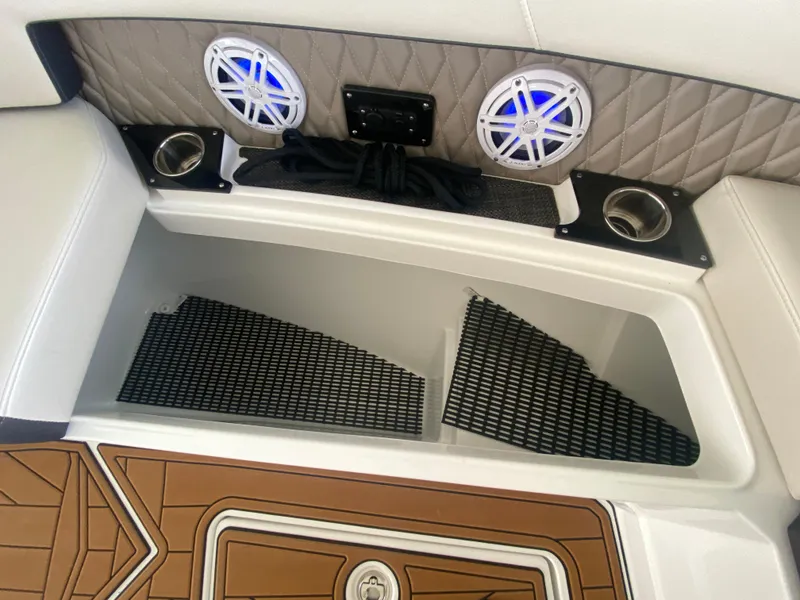 Slide: The Image of 2022 Monterey 385 Super Sport boat interior with speakers and storage compartments. - 48