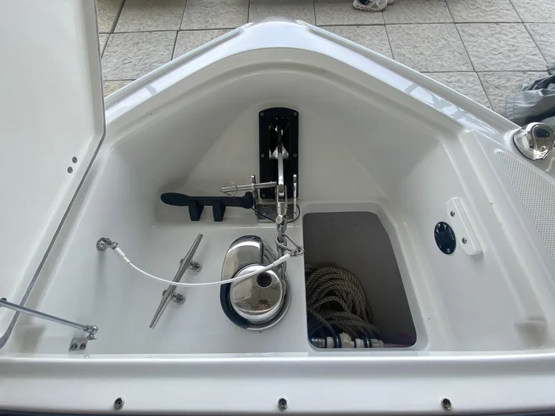 Slide: The Image of 2022 Monterey 385 Super Sport anchor compartment with rope storage and stainless steel fittings. - 49