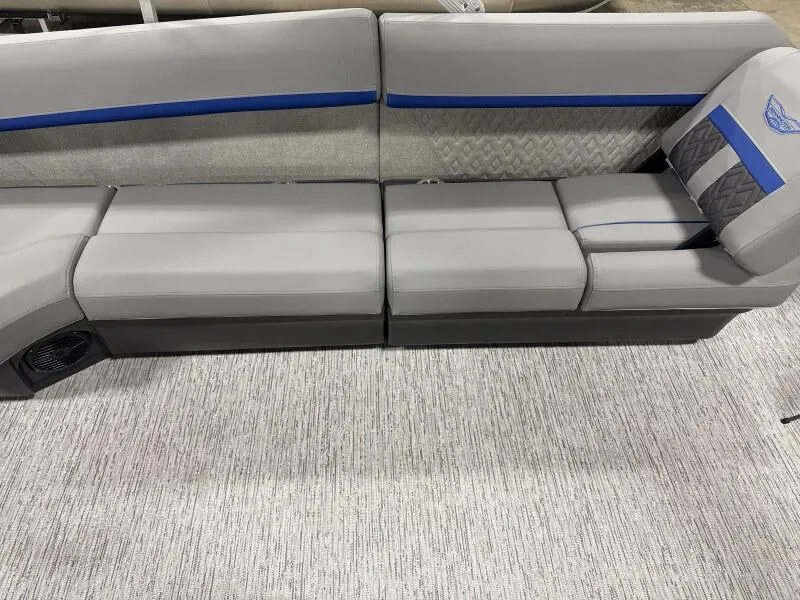 Slide: The Image of 2025 Bennington 22 MFB boat seating with gray upholstery and blue accents. - 11