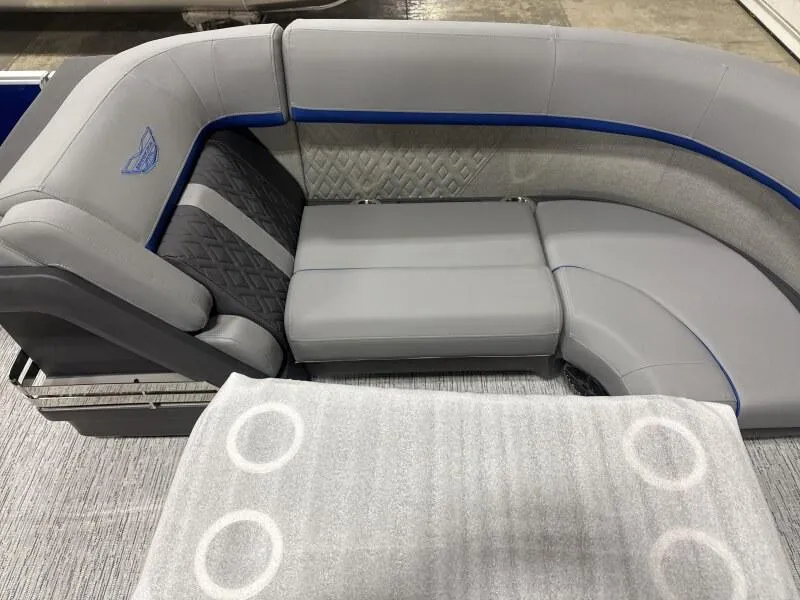 Slide: The Image of 2025 Bennington 22 MFB boat interior with gray seating and blue accents. - 9