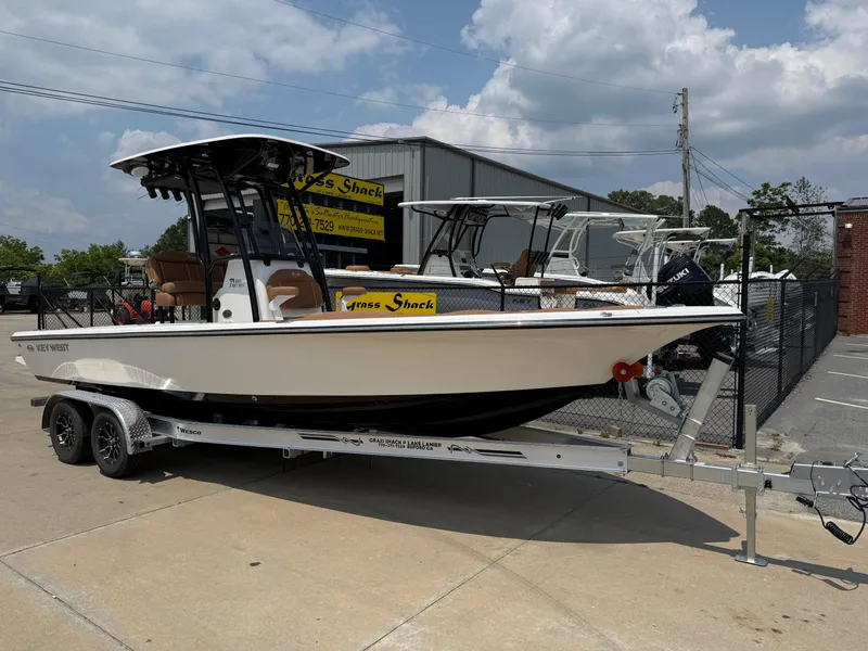 The Image of 2025 Key West 250 Bay Reef boat on trailer, parked outdoors. - 0