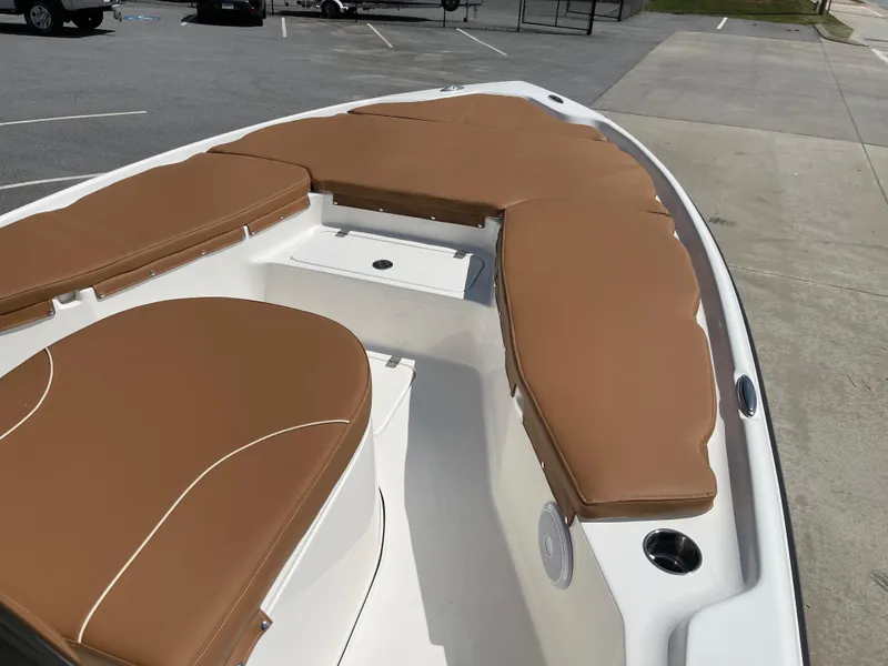 Slide: The Image of 2025 Key West 250BR boat deck, featuring storage compartments and sleek design. - 10