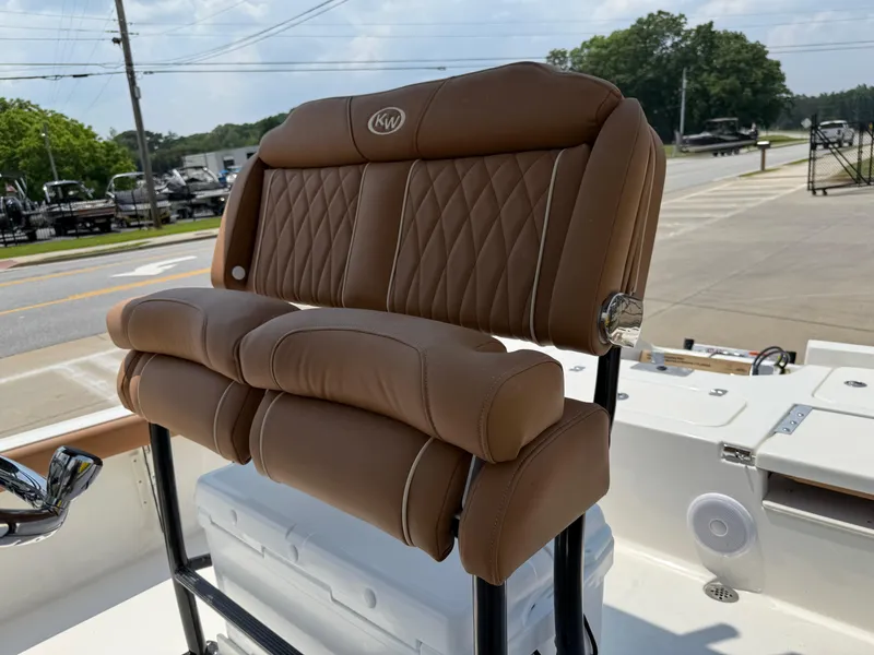 Slide: The Image of 2025 Key West 250BR boat storage compartment with open hatch, showcasing interior space. - 23