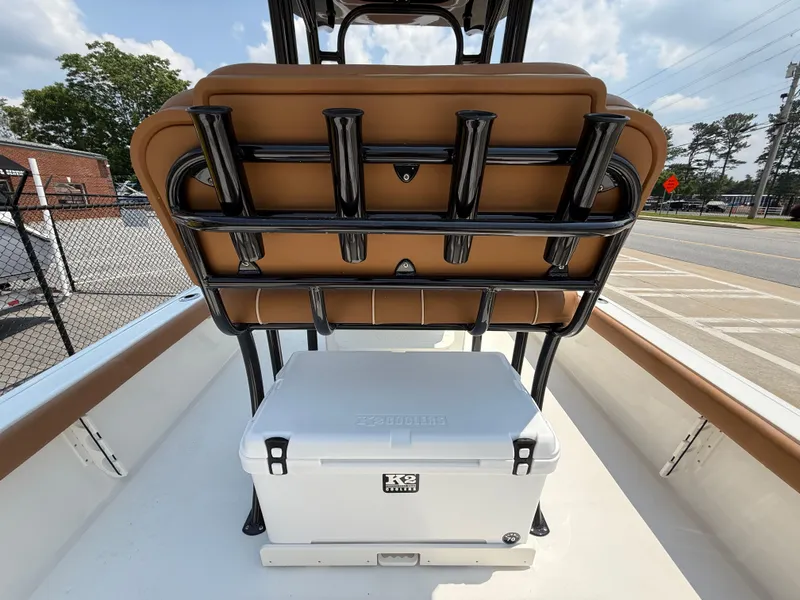 Slide: The Image of 2025 Key West 250BR boat console with steering wheel, controls, and cup holders. - 24